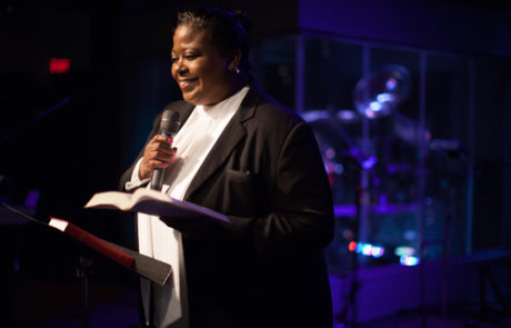 Woman Pastor Preaching from the Bible