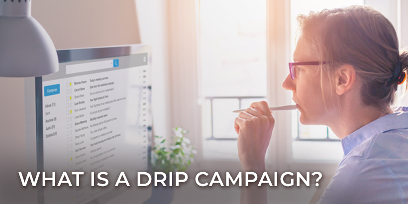 What is a drip campaign? Woman thinking about email at her desk