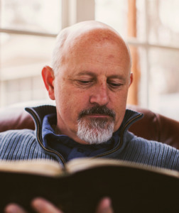 Pastor reading the Bible - SermonCentral user