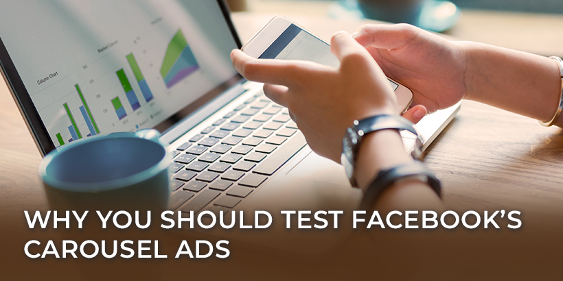 Why you should test Facebook's carousel ads - person using phone at laptop